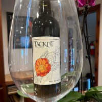Zinfandel bottle magnified with large wine glass