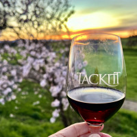 Glass of red glass with purple flowers